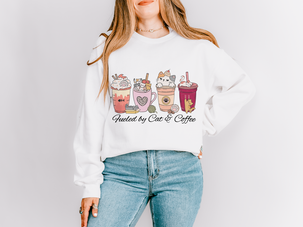 White sweatshirt with illustrated cat-themed coffee drinks and the words Fueled by Cats & Coffee