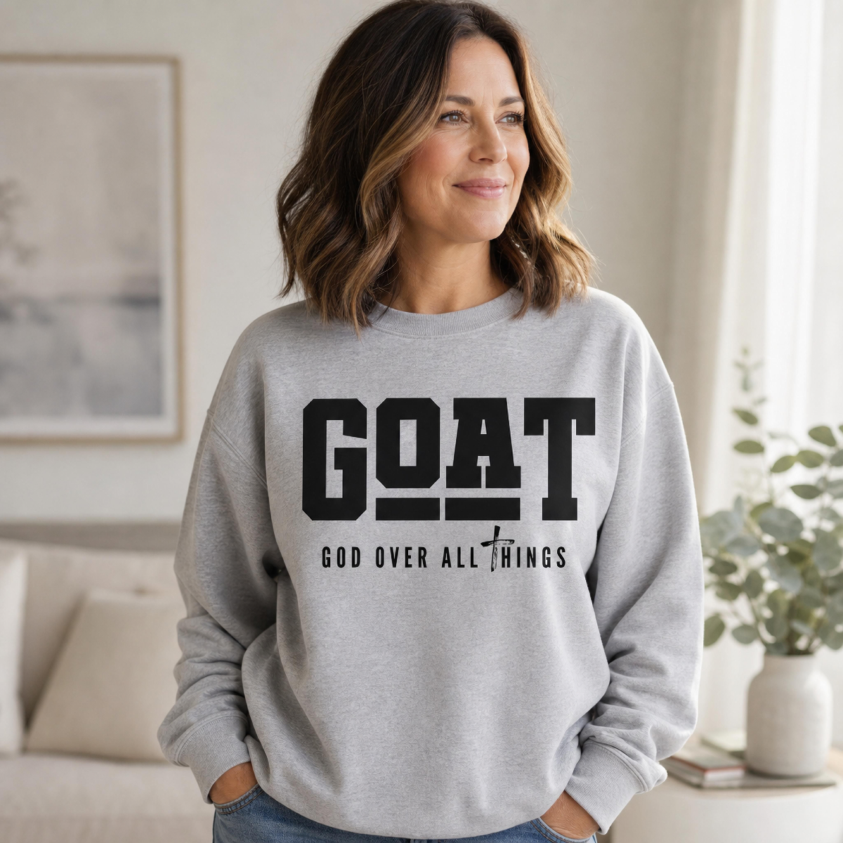 Grey crewneck sweatshirt printed with GOAT – God Over All Things
