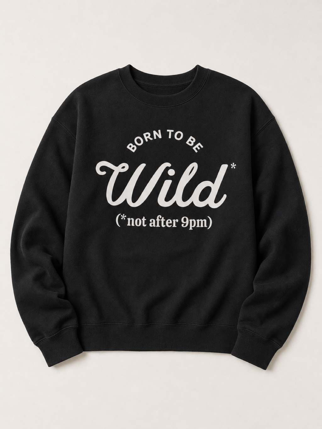 Black crewneck sweatshirt flat lay reading Born To Be Wild, not after 9pm